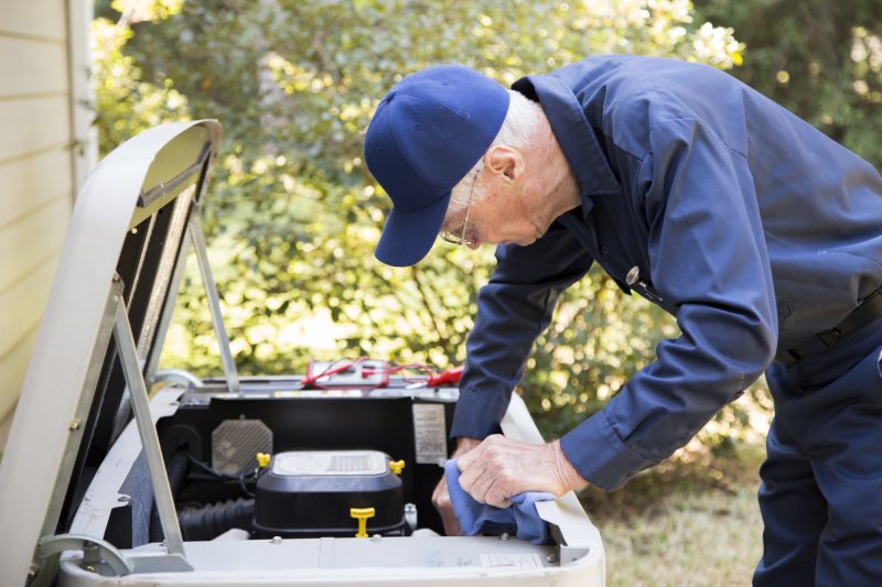 Technicians inspecting a generator